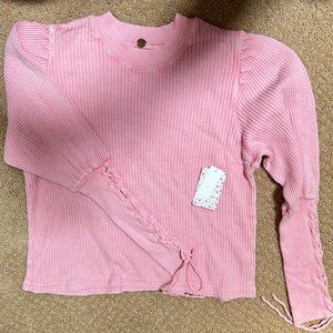 Pink Free People sweater with Lace up detailing on Arms
